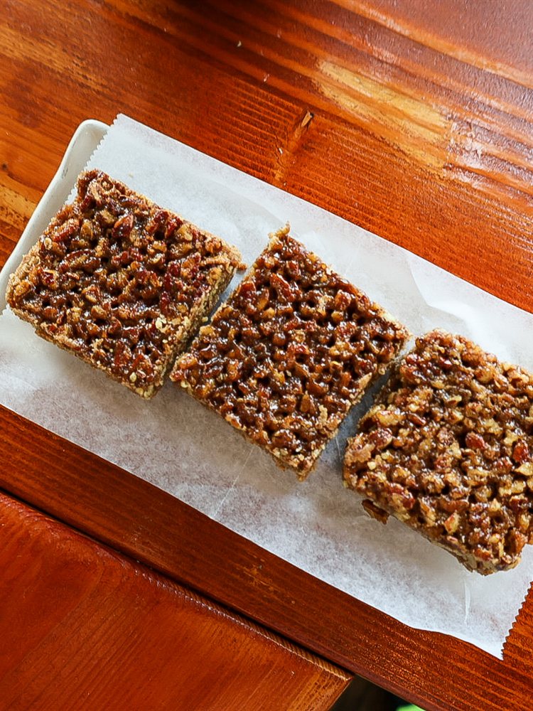 Vegan pecan pie bars on parchment paper